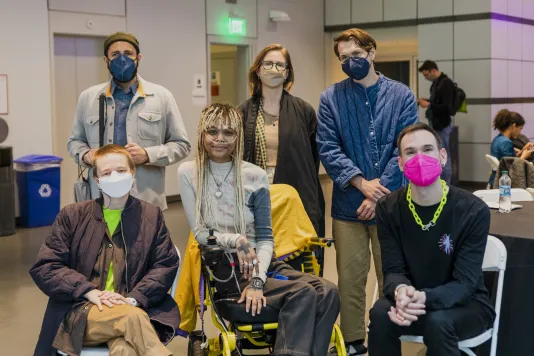 Event photograph of six participants from Altered Access looking at the camera. Three are seated and three are standing behind them.